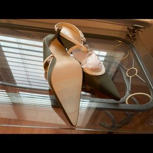 Olive and white strapped heel.